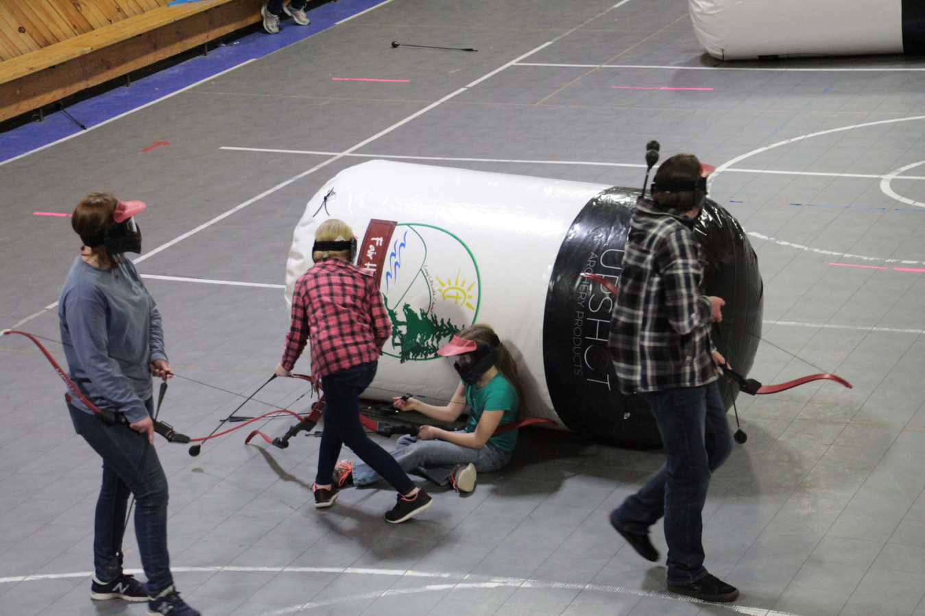 Players taking cover during an Upshot Arrow Tag game